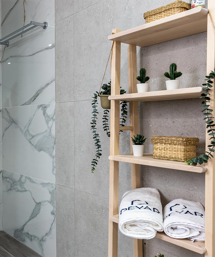 deyar house bathroom cabinet with decorative plants and deyar towels.